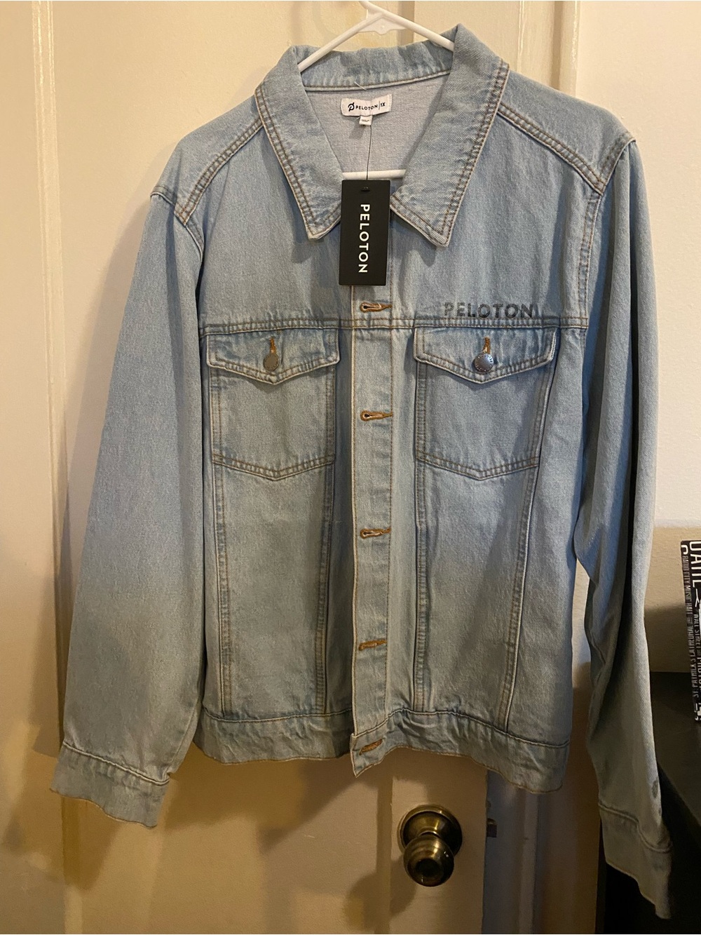 Peloton Light Blue Denim Jacket with Together we Go Far Logo
